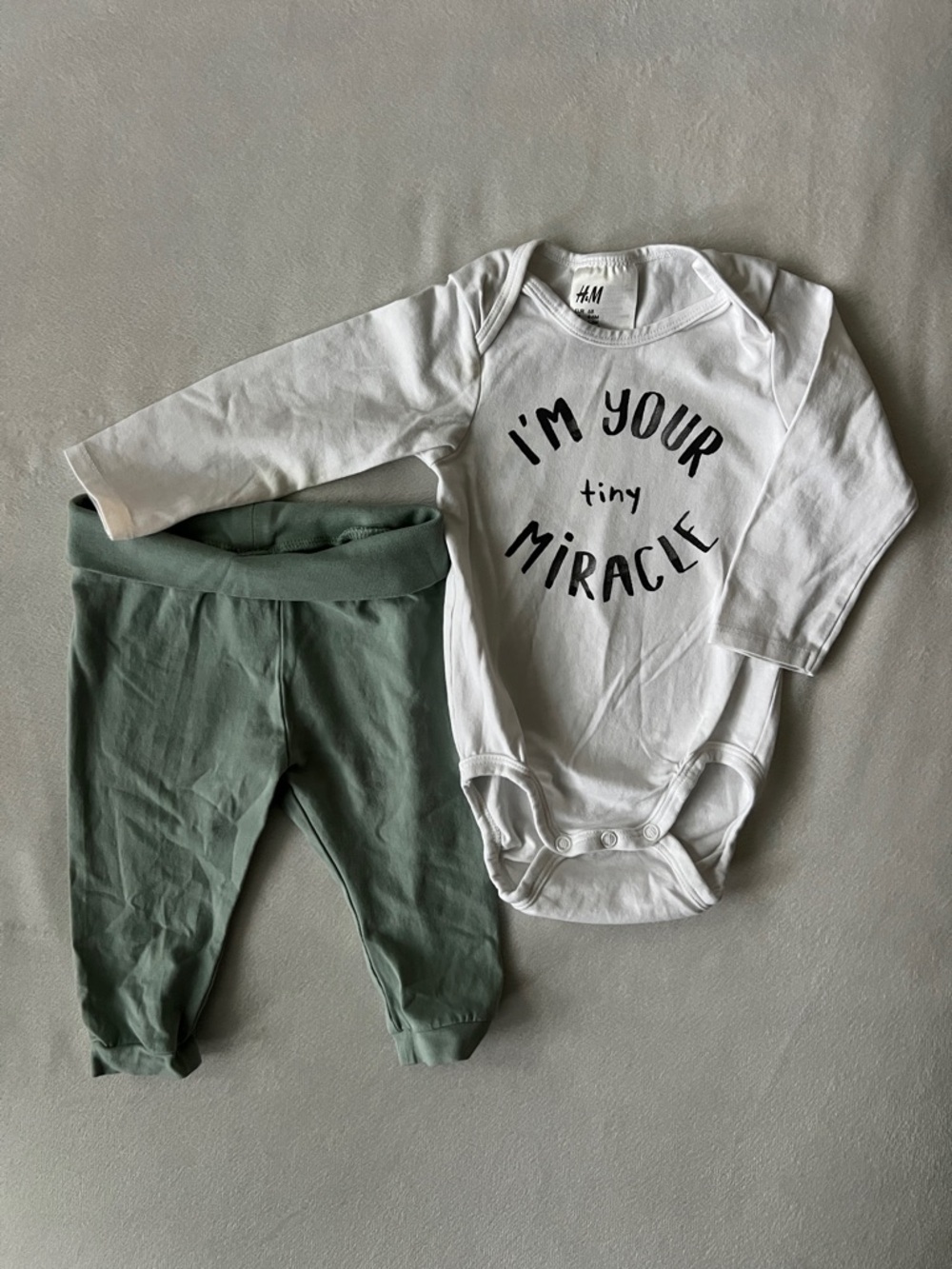 H&M White Bodysuit with Black Text & Sage Green Pants